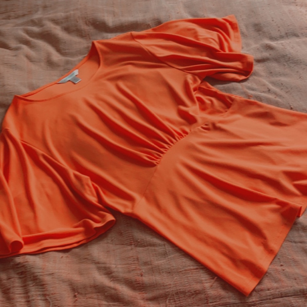 red-orange flowy blouse